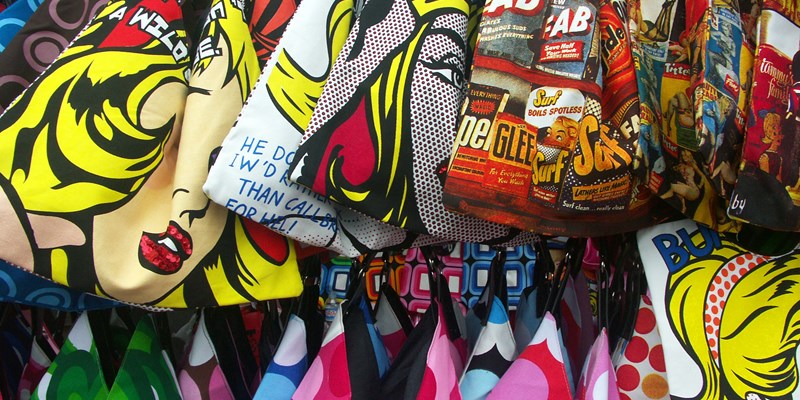 punk with a pink mohawk in from of the Camden Lock sign, London, the United Kingdom